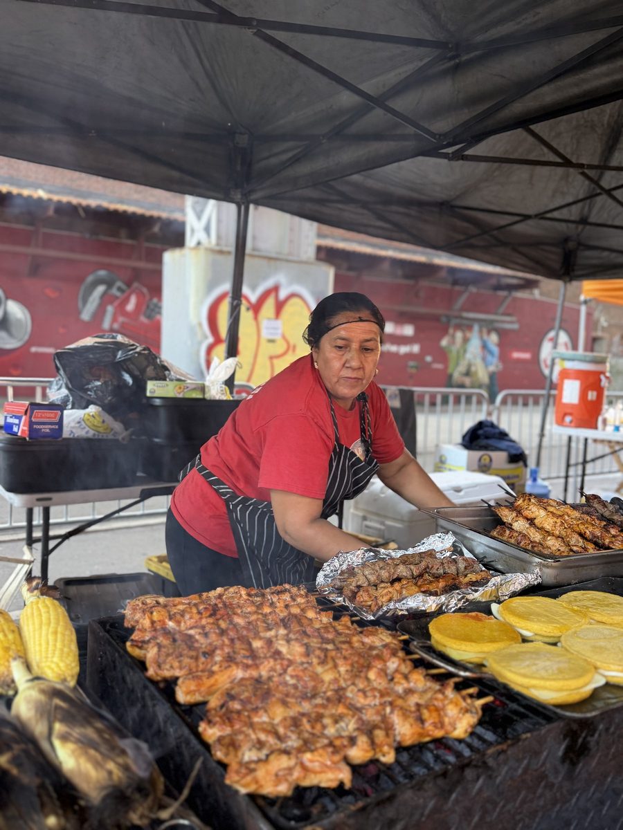 Pollo a la brasa, corn and arepas on the grill
