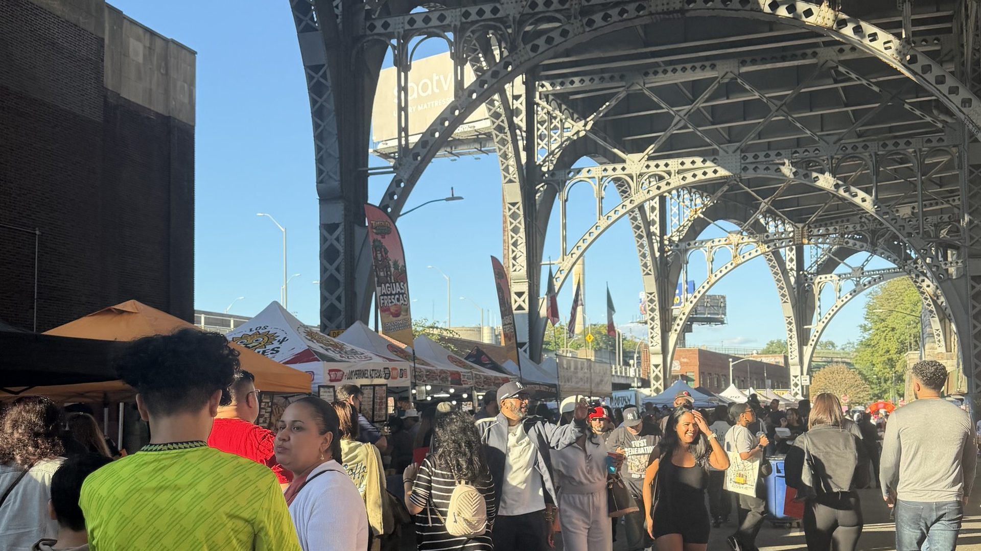 The crowd Under the Viaduct at Latin Food Fest NYC 2026, W 133rd St and 12th Ave